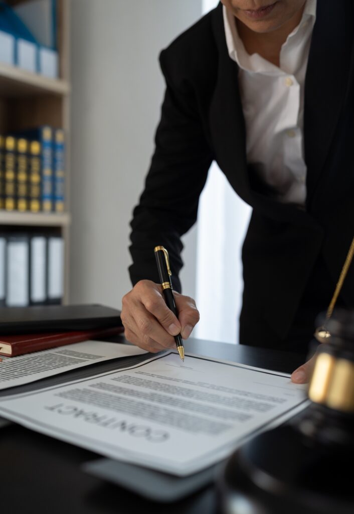 Confident lawyer or businessman examining details in real estate legal contract document Legal servi